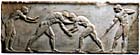 Φωτογραφία ανάγλυφης μαρμάρινης βάσης με παράσταση παλαιστών.
